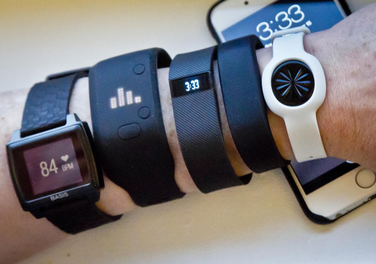 Some smartphone apps proved to be about as accurate at counting steps as several fitness trackers, according to a new study. Updated models, such as those shown here in December, were not tested, and no marks were given for other functions the devices and apps track.