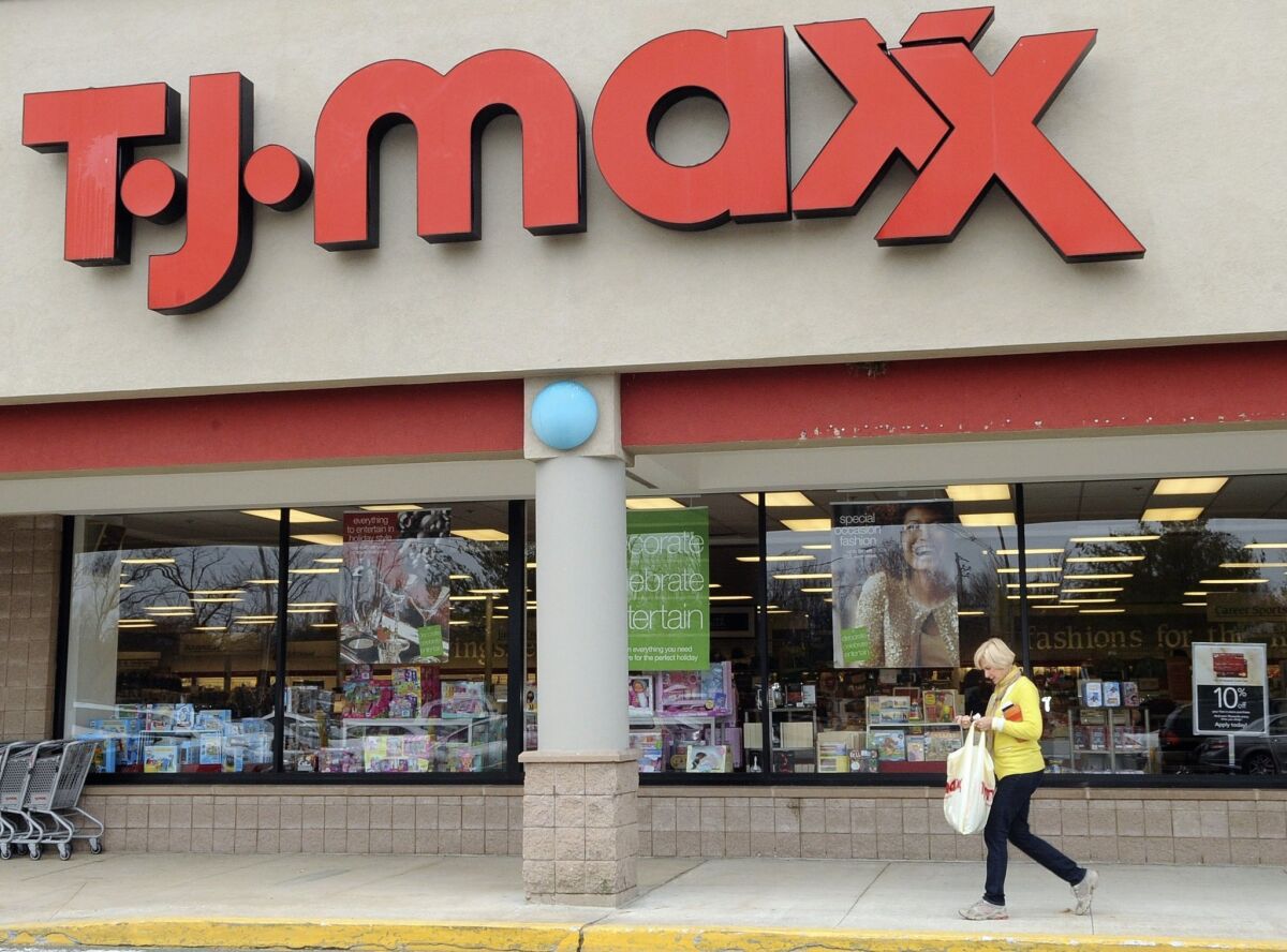 TJX Cos., the owner of T.J. Maxx Marshalls, said it will pay its U.S. workers at least $9 an hour starting in June. Above, a file photo of a T.J. Maxx store in Boston.