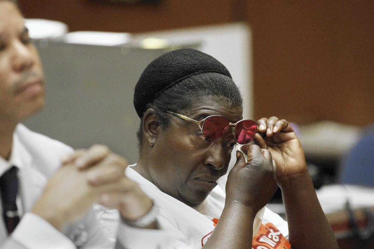 Annie Moody wipes her eye during a hearing at a downtown L.A. courthouse. Authorities say she has turned down dozens of offers of shelter or services for the homeless. Friends believe police target her because she stands up for her rights.