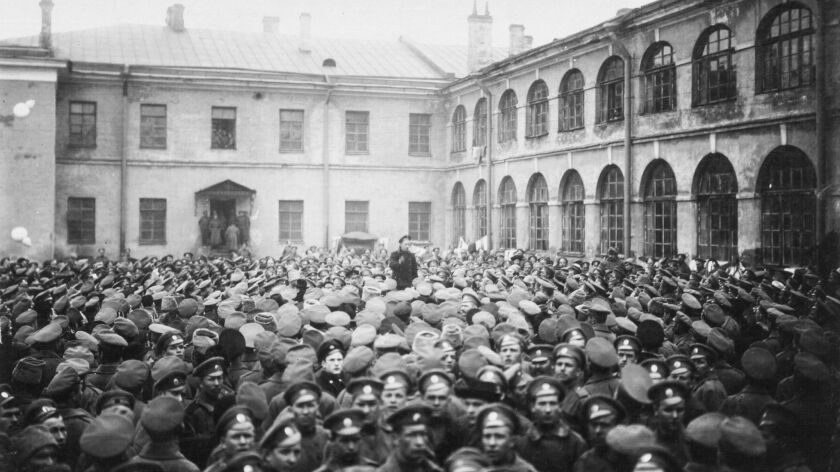 Soldiers of the Grenadier Regiments wait for Lenin's arrival on the parade ground near the barracks in St. Petersburg, Russia on Oct. 1917.