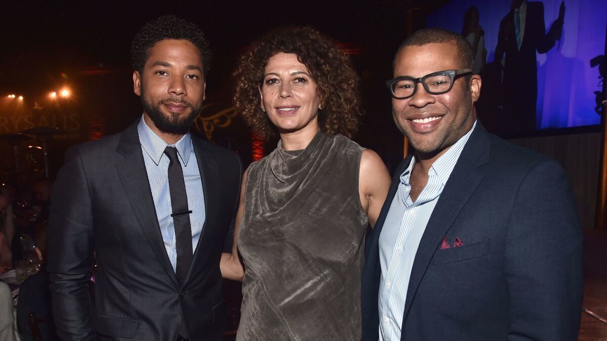 Emcee Jussie Smollett, from left, Chrysalis Butterfly Ball co-chairwoman Donna Langley and actor-writer-director Jordan Peele. (Alberto E. Rodriguez / Getty Images for Chrysalis Butterfly Ball)