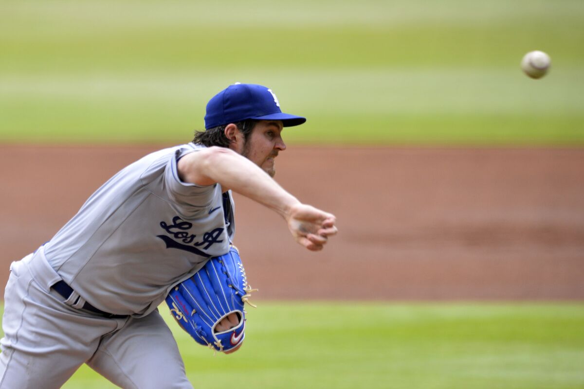 Trevor Bauer of the Los Angeles Dodgers spins a breaking ball against the Atlanta Braves on Sunday in Atlanta.