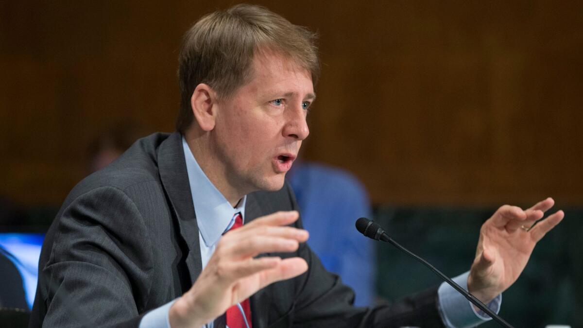 Richard Cordray, director of the Consumer Financial Protection Bureau, testifies at a Senate hearing in September.