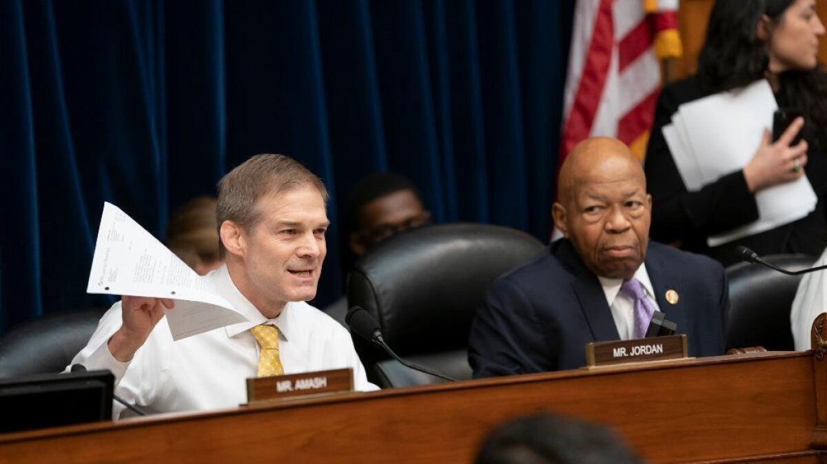 Rep. Jim Jordan, left, speaks during a House Oversight and Government Reform Committee hearing on April 2 as Chairman Elijah Cummings looks on.