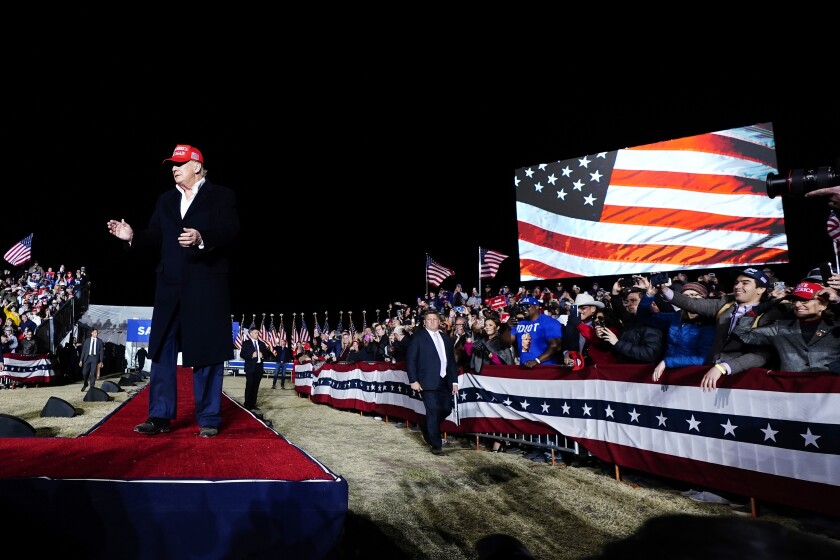 Former President Donald Trump reacts to the crowd prior to speaking at a Save America Rally Saturday, Jan. 15, 2022, in Florence, Ariz. (AP Photo/Ross D. Franklin)