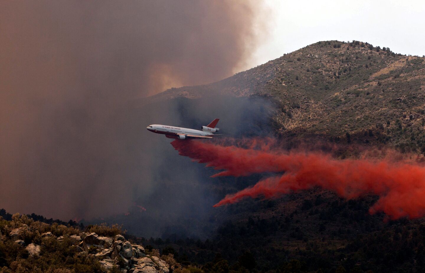 Tanker 910 makes a retardant drop on the Yarnell Hill fire to help protect the Double Bar A Ranch near Peeples Valley, Ariz.