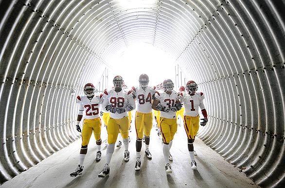 USC's Daniel Harper, left, DaJohn Harris, Kyle Moore, Stanley Havili and Patrick Turner march out to the field before a game at Washington State in Pullman. The Trojans still covet a spot in the BCS national title game but must dig out from under an early loss to Oregon State.