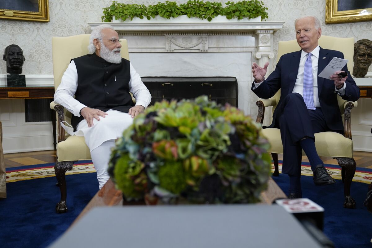 FILE - President Joe Biden meets with Indian Prime Minister Narendra Modi in the Oval Office of the White House, Sept. 24, 2021, in Washington. President Biden is set to speak with Indian Prime Minister Modi, Monday, April 11, 2022 when the two will virtually discuss the Ukraine war and other matters. India has earned Russian praise by maintaining a neutral stance in the war. India abstained when the U.N. General Assembly voted Thursday to suspend Russia from its seat on the 47-member Human Rights Council over allegations that Russian soldiers in Ukraine engaged in rights violations that the U.S. and Ukraine have called war crimes. (AP Photo/Evan Vucci, file)