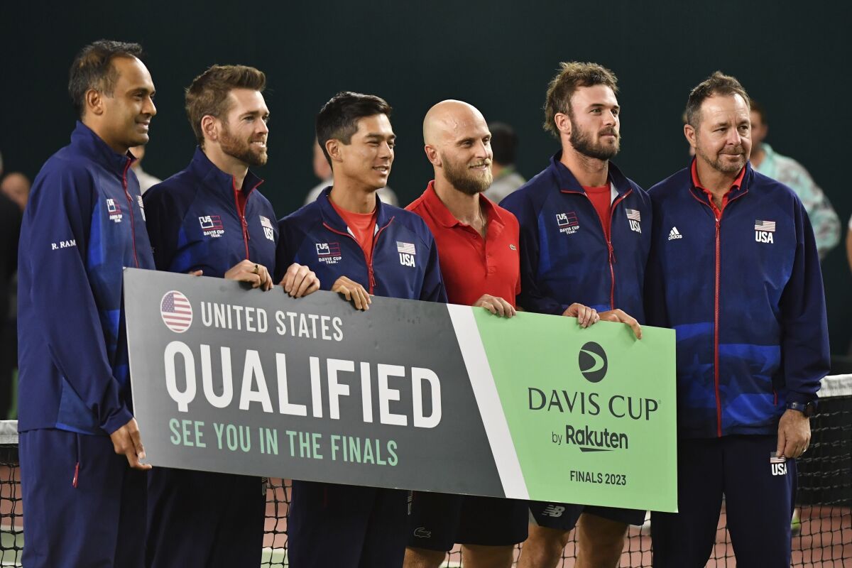 The USA team pose for a photo after playing the Davis Cup qualifier tennis match between Uzbekistan and the USA in Tashkent, Uzbekistan, Saturday, Feb. 4, 2023. The USA sweep into Davis Cup Finals with victory over Uzbekistan. (AP Photo)