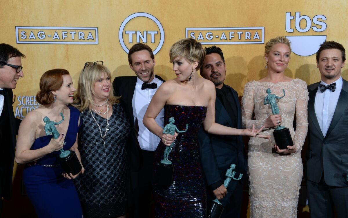 Members of the cast of "American Hustle" after winning the SAG Award for best cast in a film.
