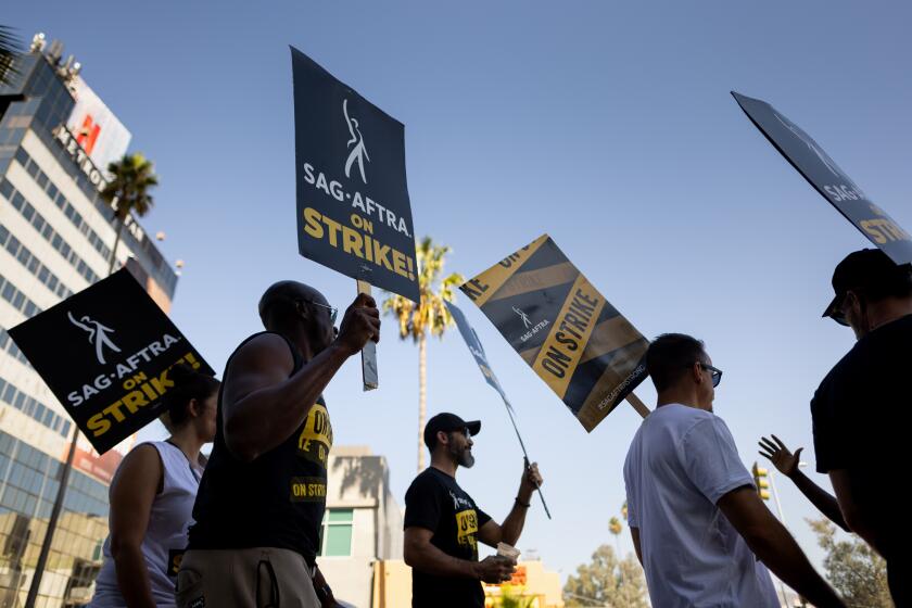 Los Angeles, CA - October 18: Supporters of SAG-AFTRA picketed in front of the Netflix offices along Sunset Boulevard, in Los Angeles, CA, Wednesday, Oct. 18, 2023. Actors have been on strike since July 14, 2023. (Jay L. Clendenin / Los Angeles Times)