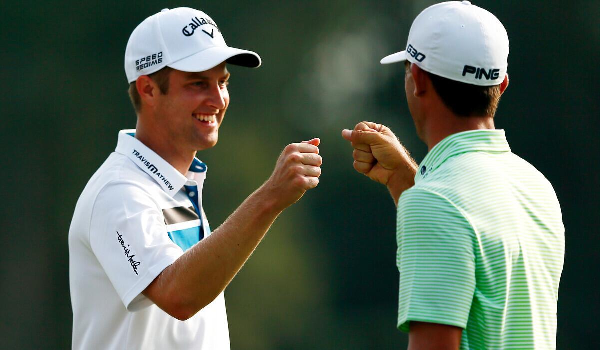 Chris Kirk, left, is congratulated by Billy Horschel after making a birdie at No. 17 during the first round of the Tour Championship on Thursday.