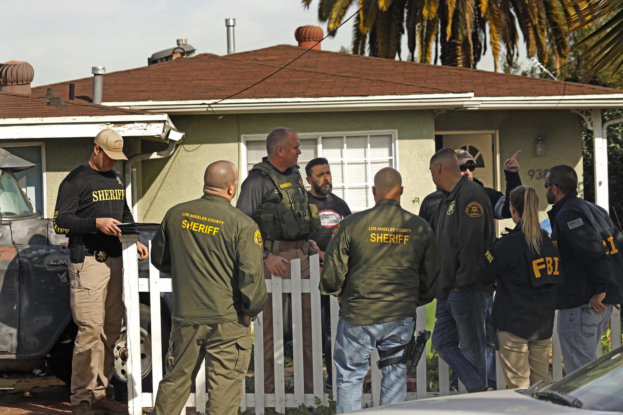 Sheriff deputies search Flores' home in 2020. 