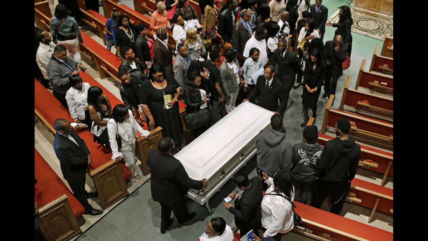 Pallbearers guide a casket containing the body of Freddie Gray out of New Shiloh Baptist Church after his funeral Monday in Baltimore.