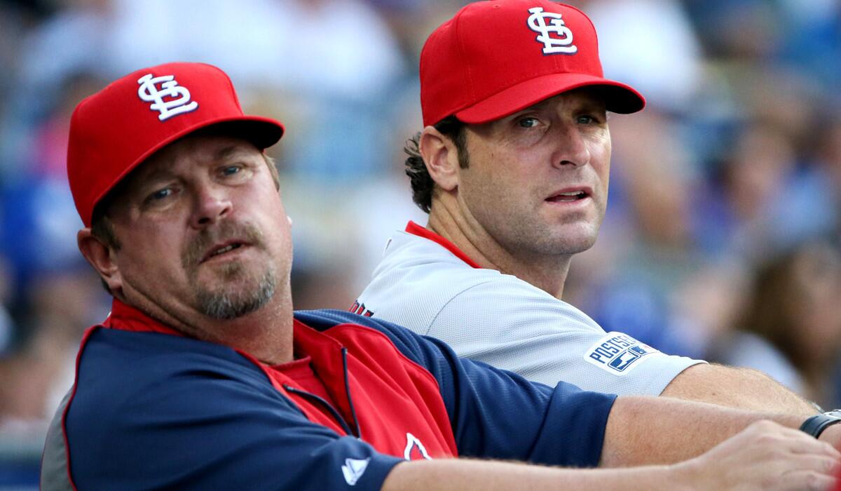 Cardinals Manager Mike Matheny, right, and pitching coach Derek Lilliquist look to the bullpen during Game 1 against the Dodgers.