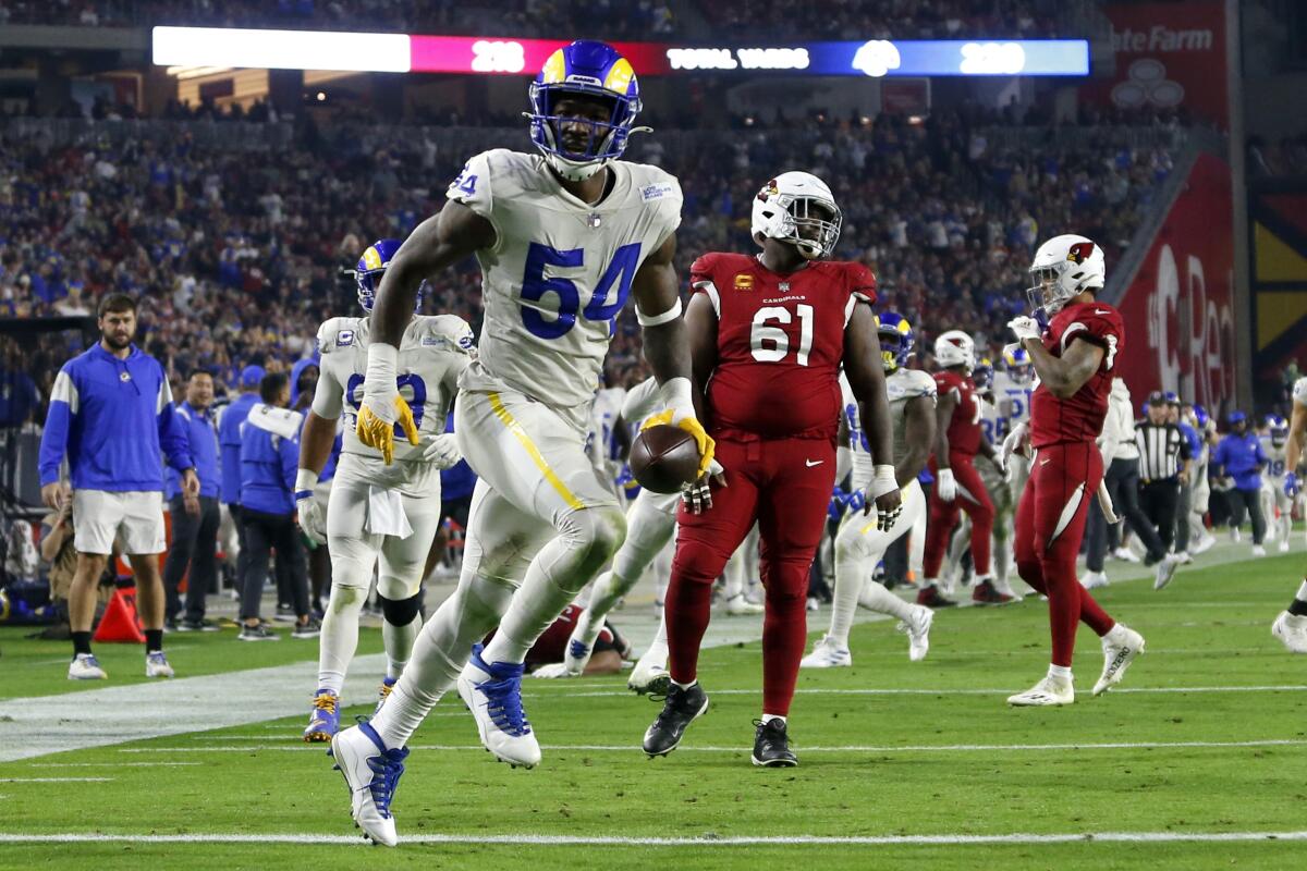 Rams outside linebacker Leonard Floyd celebrates after picking off a pass by Cardinals quarterback Kyler Murray on Monday.