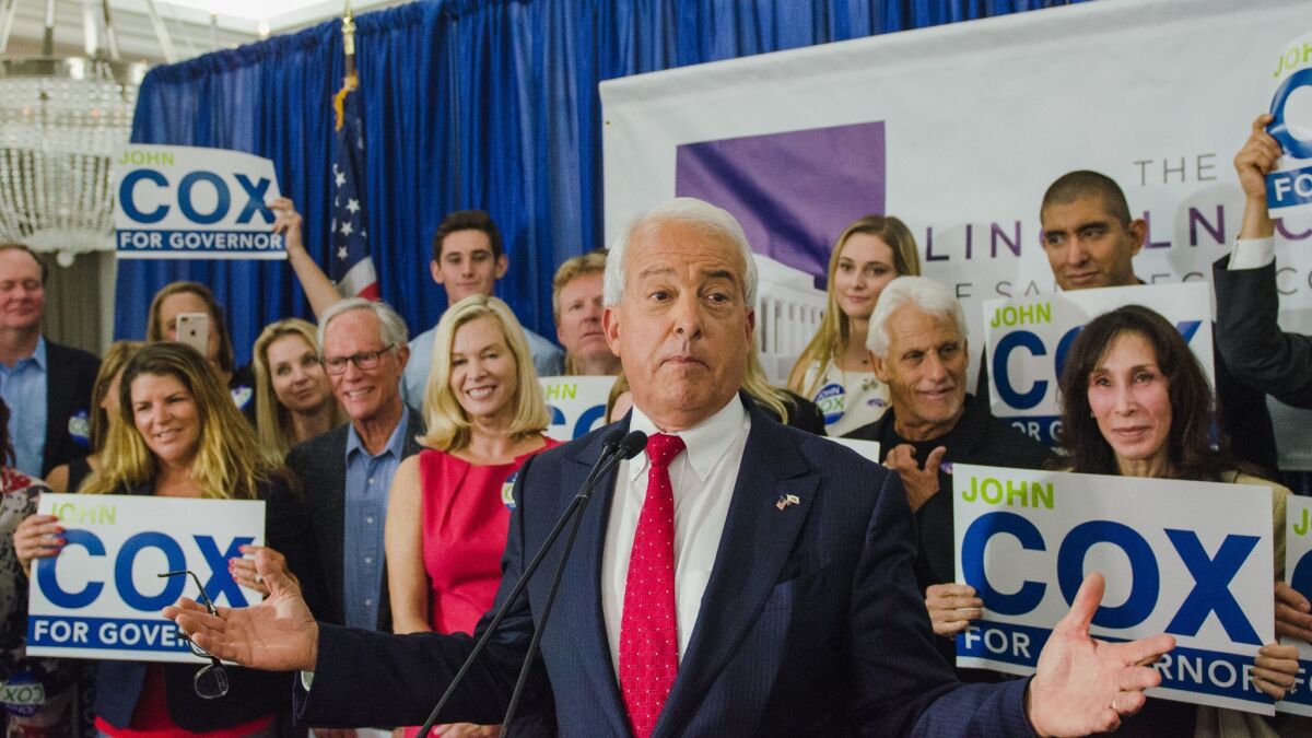 John Cox, a Republican candidate for governor, speaks to supporters during a primary night party in San Diego, Calif., last year. The Cox campaign committee has been ordered to pay almost $100,000 to an advertising agency.