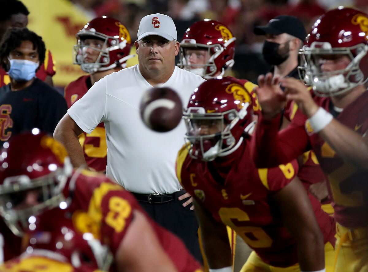 USC coach Clay Helton watches the Trojans warm up before Saturday's loss to Stanford.