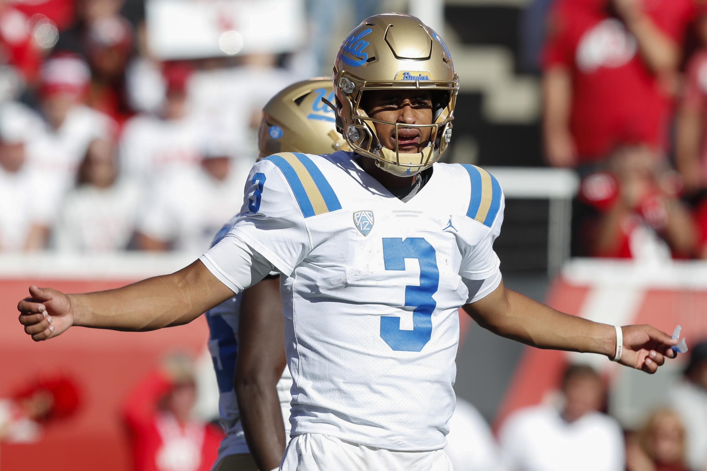 UCLA quarterback Dante Moore waits for a play call during the Bruins' 14-7 loss to Utah at Rice-Eccles Stadium.