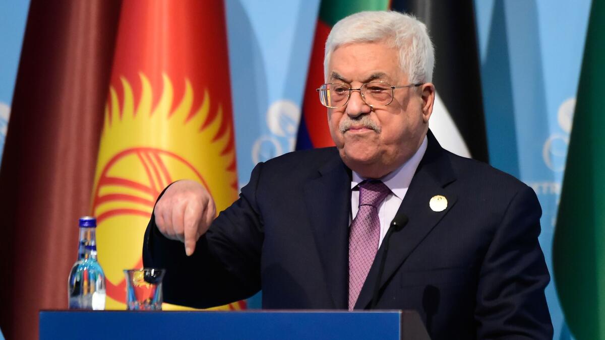 Palestinian Authority President Mahmoud Abbas speaks with reporters following the meeting Wednesday of the Organization of Islamic Cooperation on last week's U.S. recognition of Jerusalem as Israel's capital.