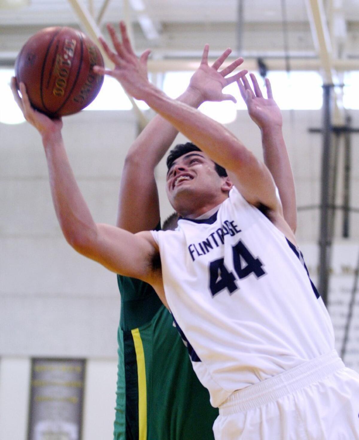 Flintridge Prep's Dante Fregoso goes to the hoop during the Rebels' CIF Southern Section Division V-AA championship loss to St. Joseph.