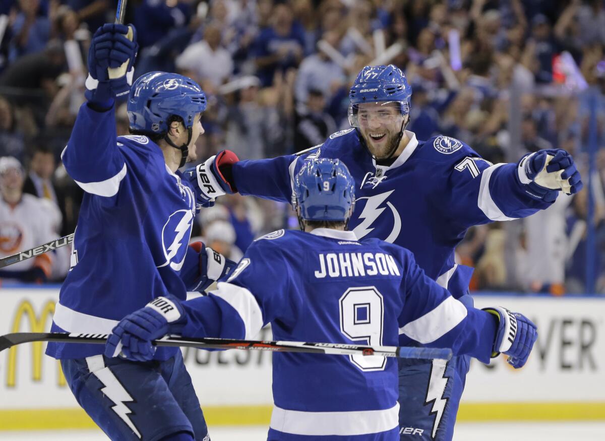 Lightning defenseman Victor Hedman (77) is congratulated by forwards Tyler Johnson (9) and Brian Boyle (11) after scoring a goal during the second period of a playoff game on April 30.