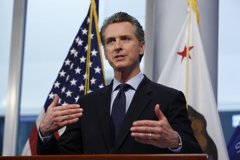 In this photo taken Thursday, April 9, 2020, Gov. Gavin Newsom gives his coronavirus update at the Governor's Office of Emergency Services in Rancho Cordova, Calif. California public health officials said Friday, April 10, that the spread of the coronavirus in the state might not be as high as expected. Newsom said he was already making detailed plans on how to re-open the state while still stressing the need for people to say at home and stay away from others. (AP Photo/Rich Pedroncelli)