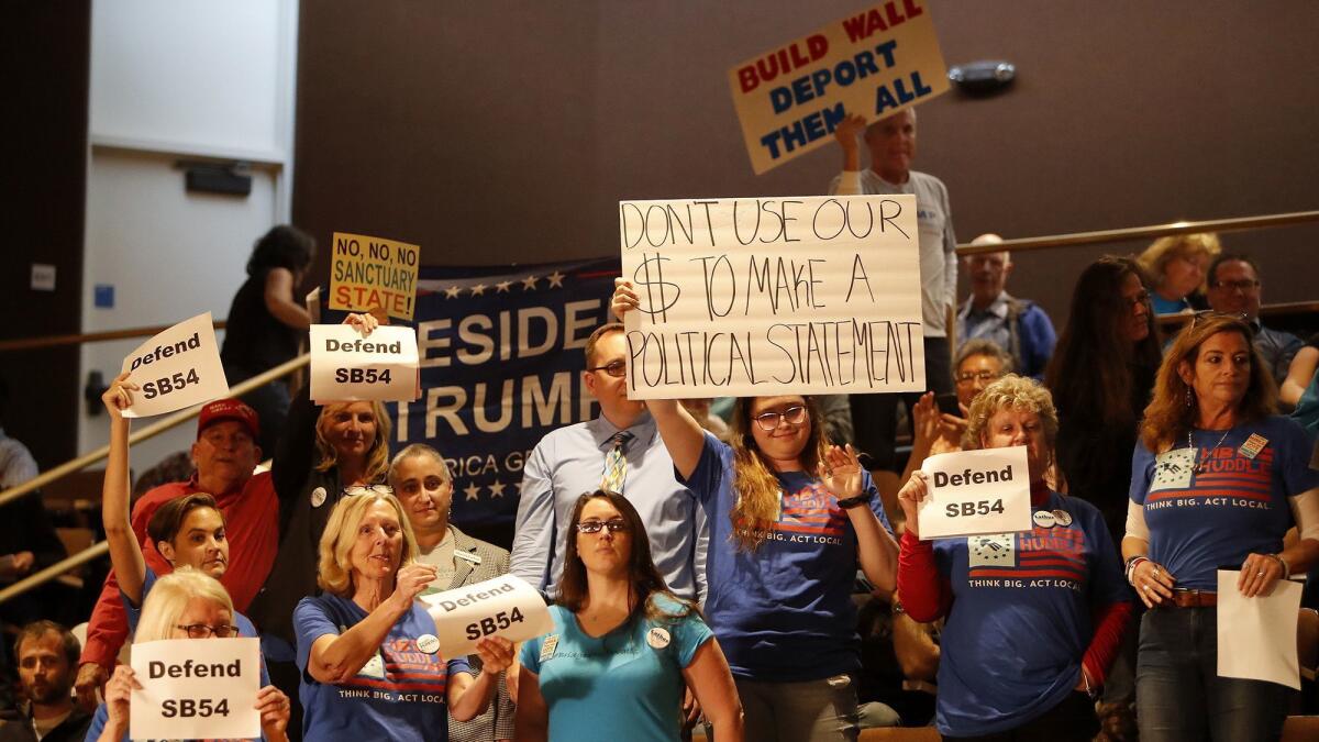 Supporters and opponents of California’s “sanctuary state” laws let the Huntington Beach City Council know their opinions at a meeting Monday.