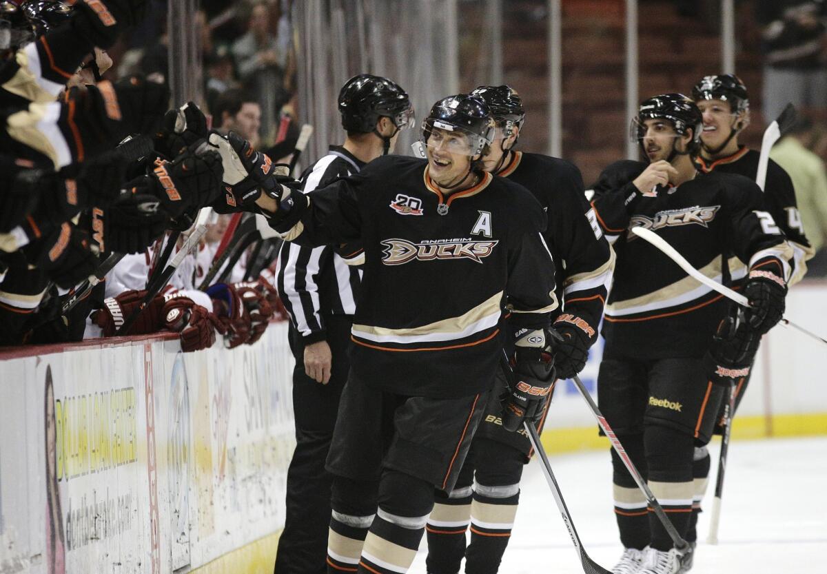 Ducks forward Teemu Selanne, center, celebrates after scoring a goal during a win over the Phoenix Coyotes on Oct. 18.