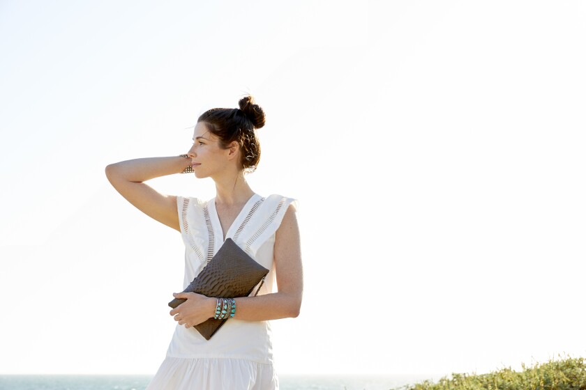 A model holds a bag from L.A. eco-chic travel accessories brand Rivers Eight.