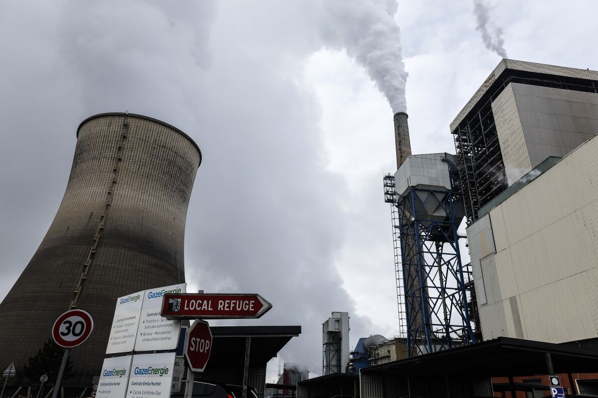 View of the coal-fired power station Tuesday, Nov. 29, 2022 in Saint-Avold, eastern France. The plant should have been closed permanently at the end of last winter, but the government resumed its operation due to the energy crisis. (AP Photo/Jean-Francois Badias)