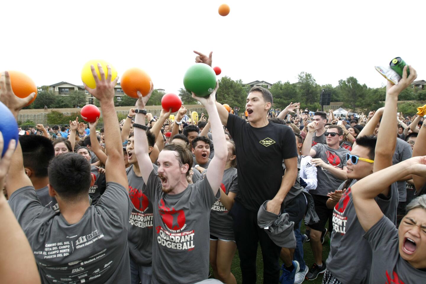 The gray team celebrates beating three other teams after about more than one hour of four-quadrant dodgeball play at UC Irvine's Anteater Recreation Center sports field on Tuesday, Sept. 20, 2016. The university attempted to break a Guinness World Record for the largest game of four-quadrant dodgeball.