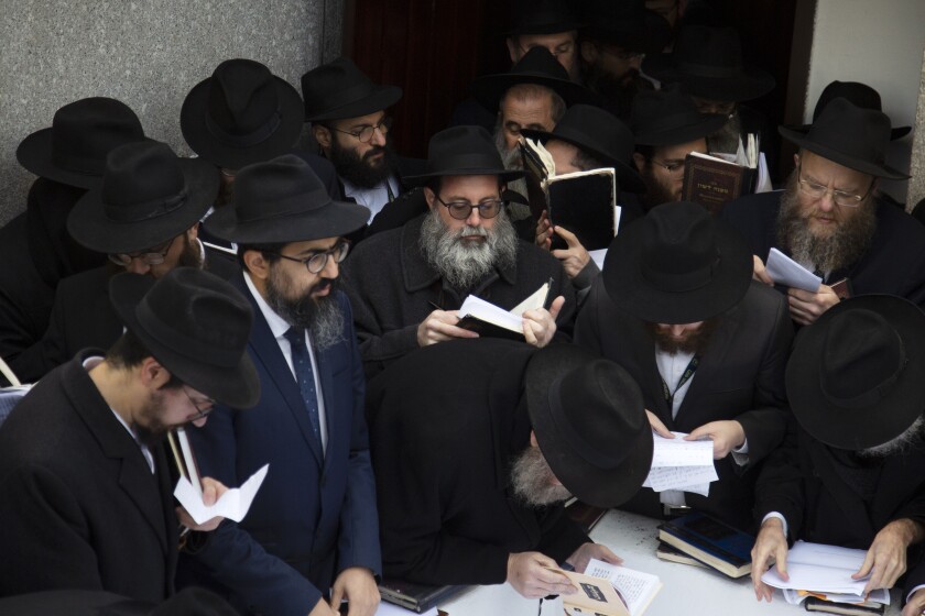 Hasidic leaders gather at the resting place of the late Rabbi Menachem Mendel Schneerson in New York on Friday.