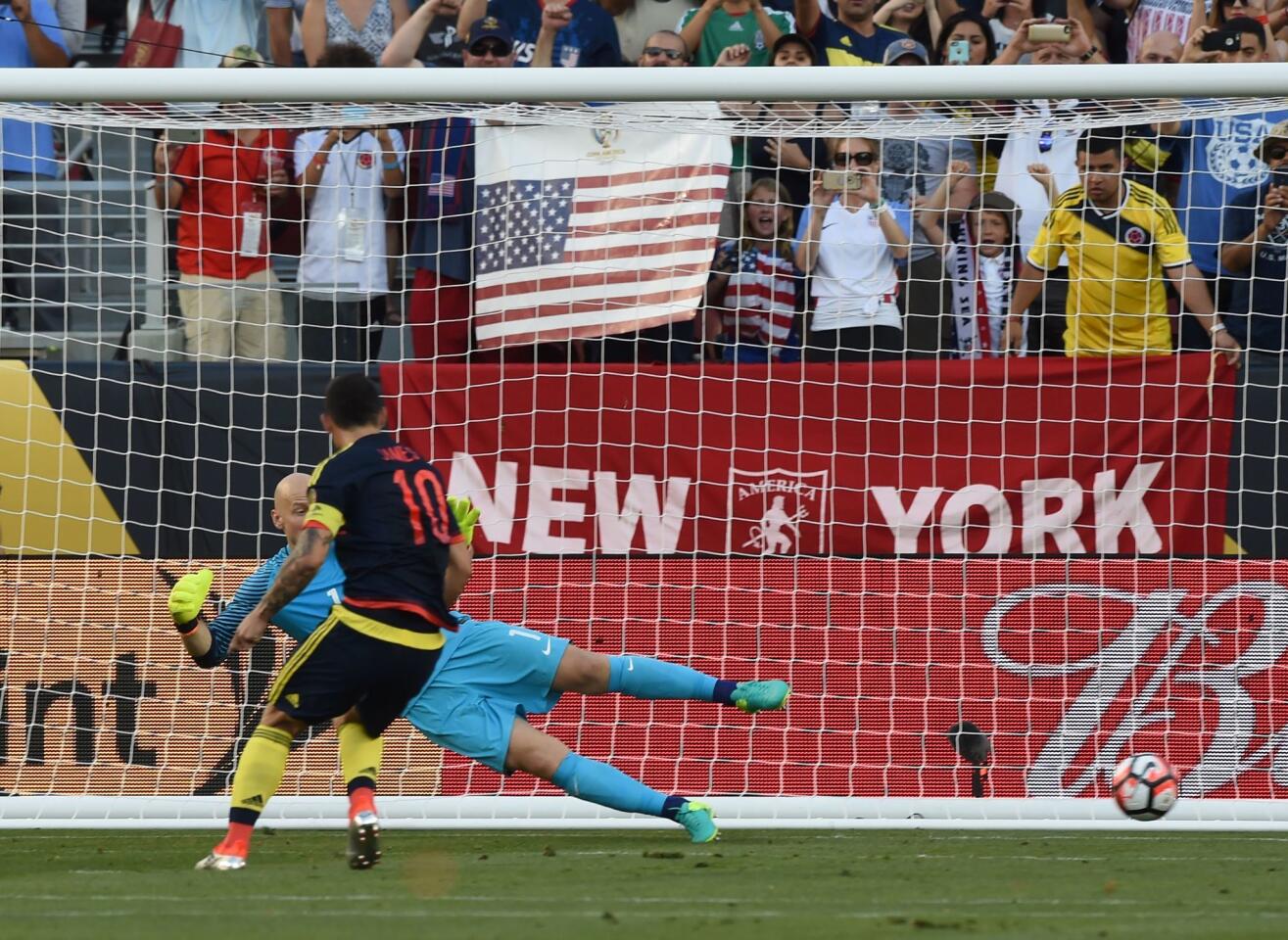 Colombia's James Rodriguez scores a penalty past USA's goalkeeper Brad Guzan during the Copa America Centenario football tournament match in Santa Clara, California, United States, on June 3, 2016. / AFP PHOTO / MARK RALSTONMARK RALSTON/AFP/Getty Images ** OUTS - ELSENT, FPG, CM - OUTS * NM, PH, VA if sourced by CT, LA or MoD **