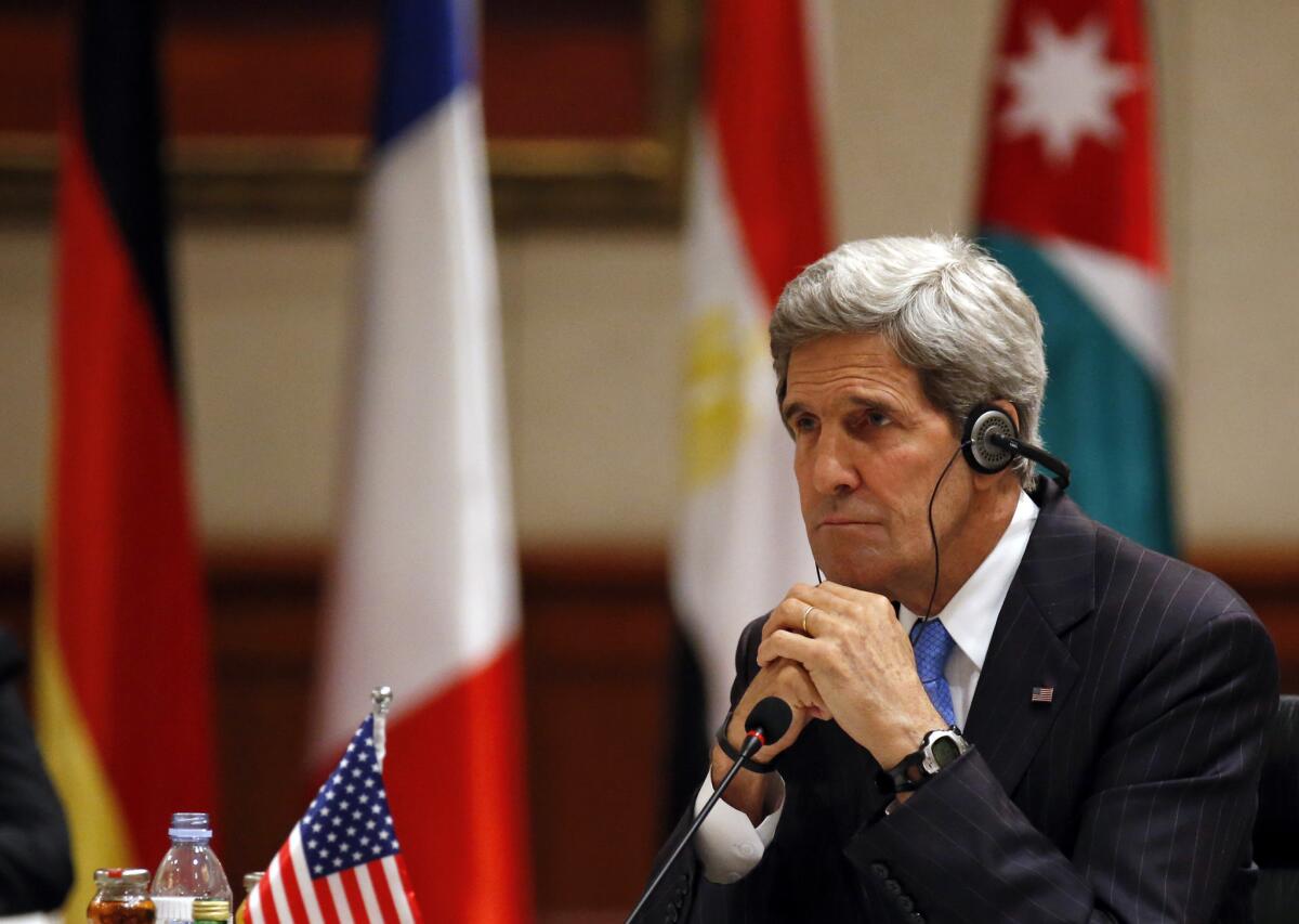 Secretary of State John Kerry listens about Syria at a meeting of the London 11 in Amman, Jordan.