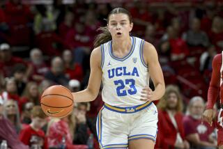 UCLA forward Gabriela Jaquez controls the ball during a game against Arkansas.