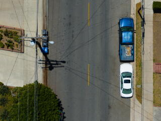 Telephone poles carrying utility lines hang over Canyon Drive in Los Angeles on Thursday.