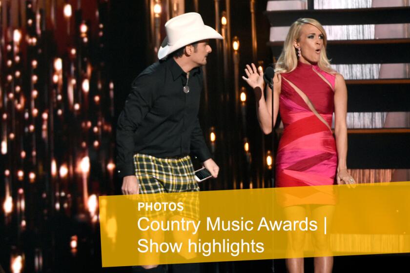 Co-hosts Brad Paisley, left, and Carrie Underwood perform a skit during the opening bit.