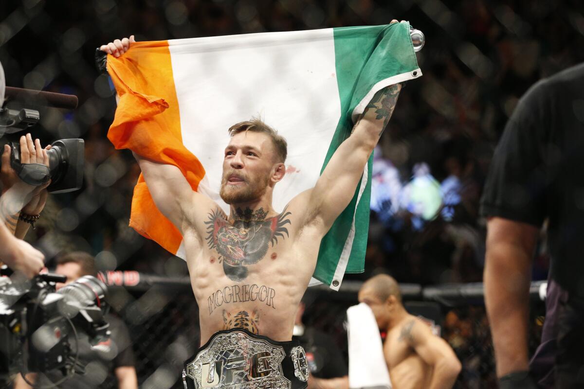 Conor McGregor reacts after defeating Jose Aldo for the featherweight title at UFC 194 in Las Vegas.