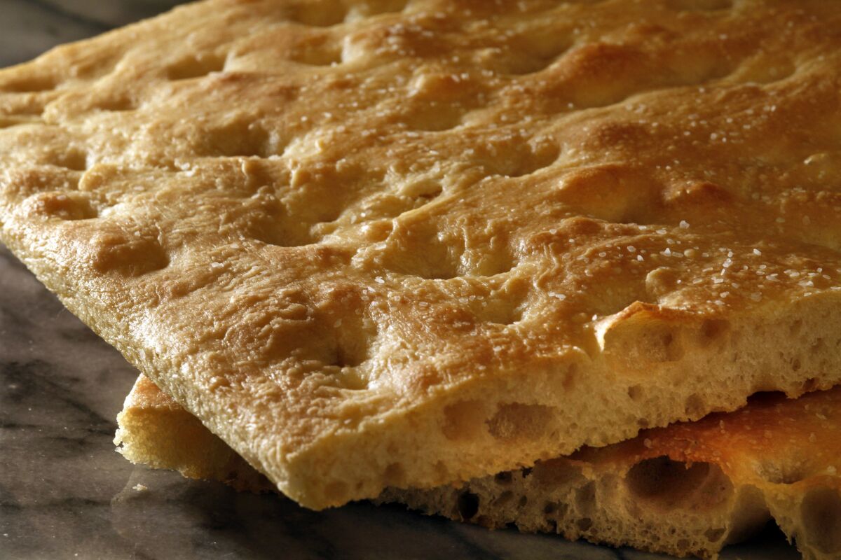 Real focaccia is a lot closer to pizza than it is to sandwich bread. In fact, if you imagine a slightly thicker, crisp-crusted, rectangular pizza with restrained toppings, you're just about there. Here's a photo gallery walking you through the focaccia recipes, step-by-step.