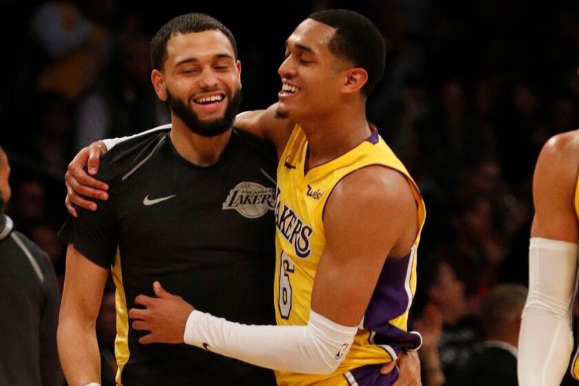LOS ANGELES, CA - JANUARY 19, 2018: Los Angeles Lakers guard Jordan Clarkson (6) gets a hug from Los Angeles Lakers guard Tyler Ennis (10) after his three-pointer seals the win against the Indiana Pacers 99-86 at Staples Center on January 19, 2018 in Los Angeles, California. Clarkson scored 33 points.(Gina Ferazzi / Los Angeles Times)