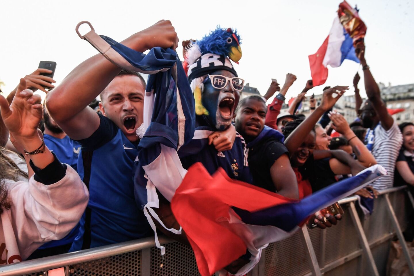 Spectators in a fan zone in Paris celebrate France's first goal in Tuesday's World Cup semifinals match.