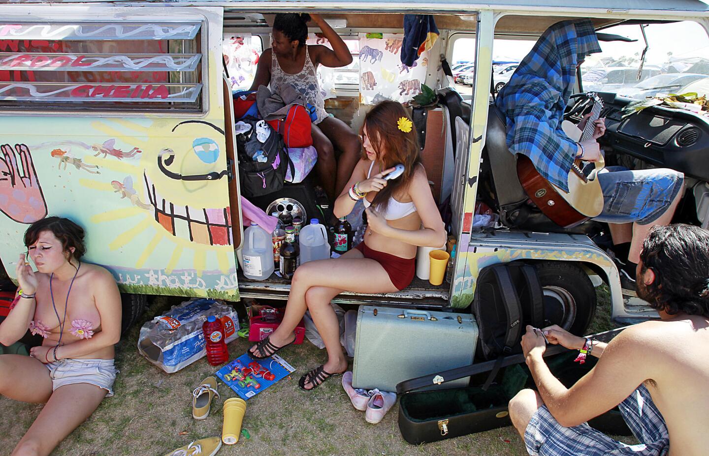 A group of festivalgoers chill out at an onsite campground Sunday, April 17, 2011, at the Coachella Music & Arts Festival in Indio.