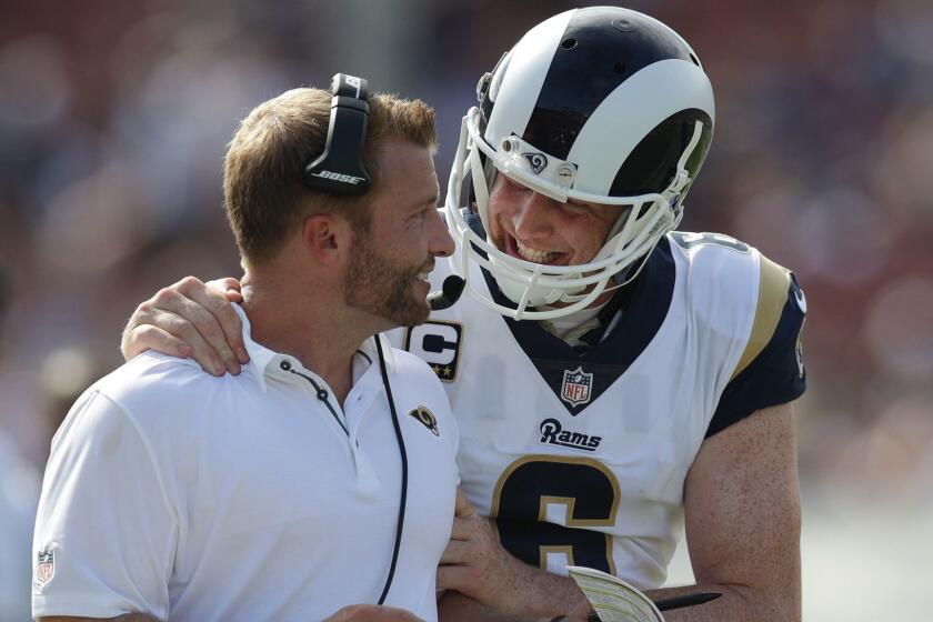 CORRECTS TO PUNTER JOHNNY HEKKER, NOT QUARTERBACK GOFF - Los Angeles Rams head coach Sean McVay, left, talks with punter Johnny Hekker during the second half of an NFL football game against the Indianapolis Colts, Sunday, Sept. 10, 2017, in Los Angeles. (AP Photo/Jae C. Hong)