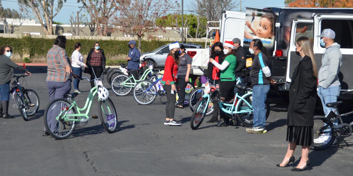  FRC representatives lined up Thursday to accept donated bikes to be distributed among all 16 Orange County facilities.