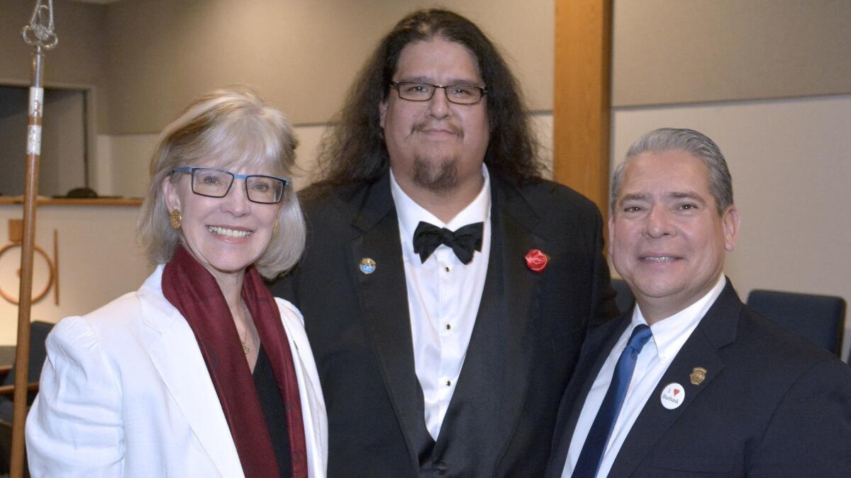 The community service of outgoing Worshipful Master Jhairo Echevarria, center, was honored at last week's ceremony by Mayor Emily Gabel-Luddy and Councilman Bob Frutos.