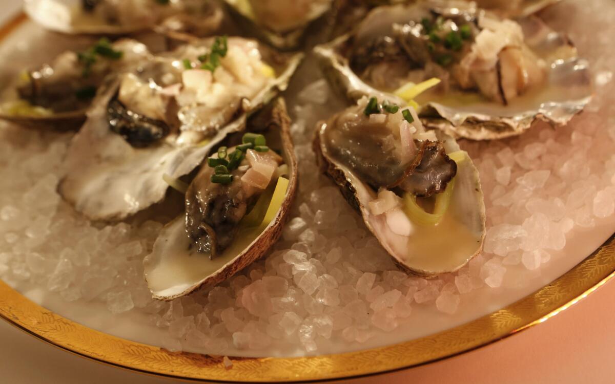 Warm oysters in their shells with leeks and Champagne butter