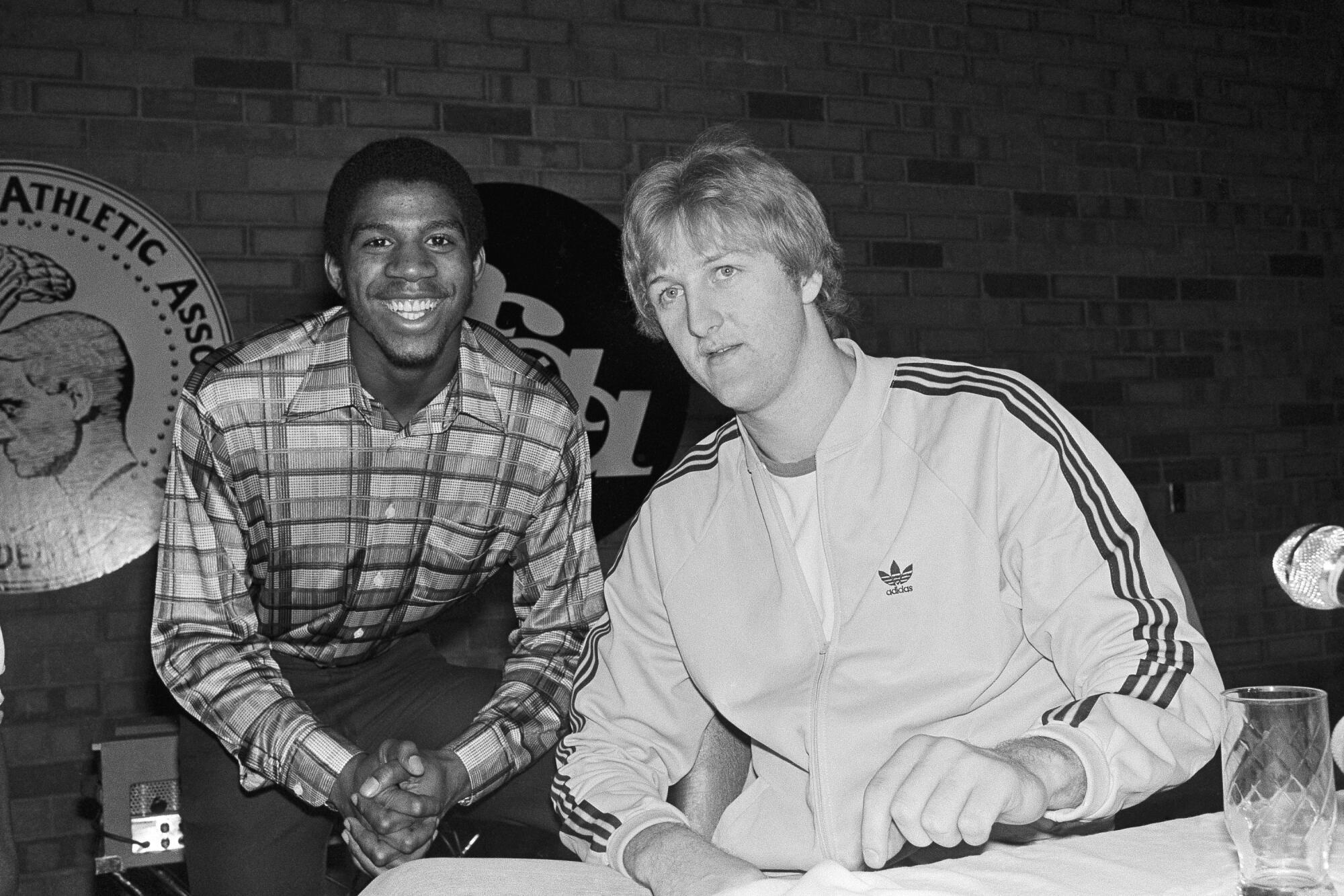 Magic Johnson and Larry Bird in March 1979 in street clothes.