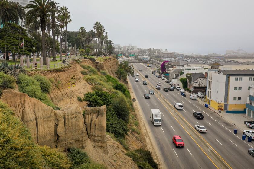 Santa Monica, CA - July 25: A Drone's view along Pacific Coast Highway, where erosion of the Santa Monica, CA, bluffs is seen on Tuesday, July 25, 2023, in advance of the city of Santa Monica performing an emergency removal of the portion jetting out toward PCH below. (Jay L. Clendenin / Los Angeles Times)