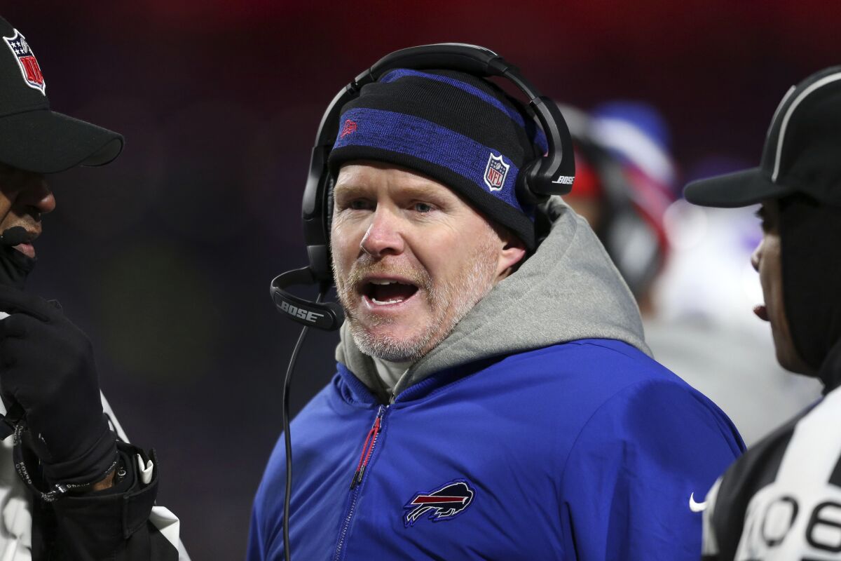 Buffalo Bills head coach Sean McDermott, center, talks with officials during the second half of an NFL football game against the New England Patriots in Orchard Park, N.Y., Monday, Dec. 6, 2021. (AP Photo/Joshua Bessex)
